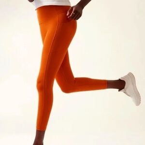 Athleta Salutation Stash Pocket Salutation Tights | 1X | Sunrise Orange | NWT